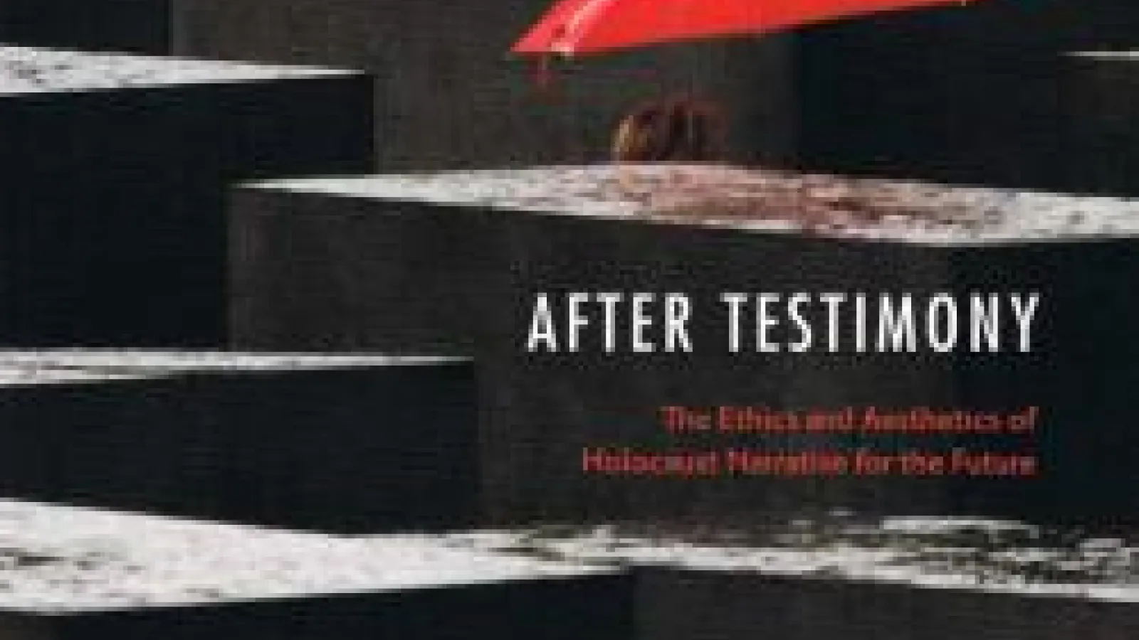 Detail of the book cover of "After Testimony," a red umbrella appearing among rain-drenched concrete blocks at Berlin's Memorial to the Murdered Jews of Europe
