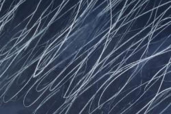 Detail of Cy Twombly's "Untitled" (1970), light gray curving lines on a dark blue-gray field